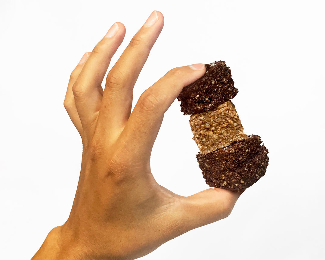 Photo of stack of three vegan protein snacks made of sprouted nuts.