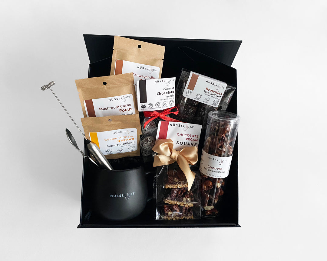 Photo of Vegan gift basket filled with redefined vegan baked goods made with sprouted nuts, vegan chocolate, and organic superfoods.