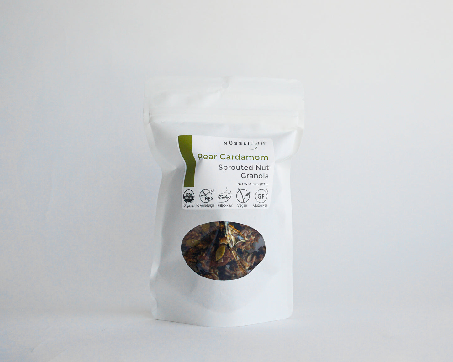 Image of compostable bag containing pear cardamom granola made of sprouted nuts and sprouted seeds by Nussli118.rom 