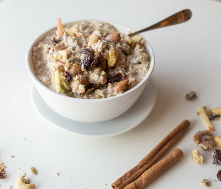 Photo of vegan protein snack with sprouted nuts on top in a bowl.